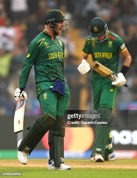 Heinrich Klaasen of South Africa celebrates their century during the ICC Men's Cricket World Cup India 2023 match between England and South Africa at...
