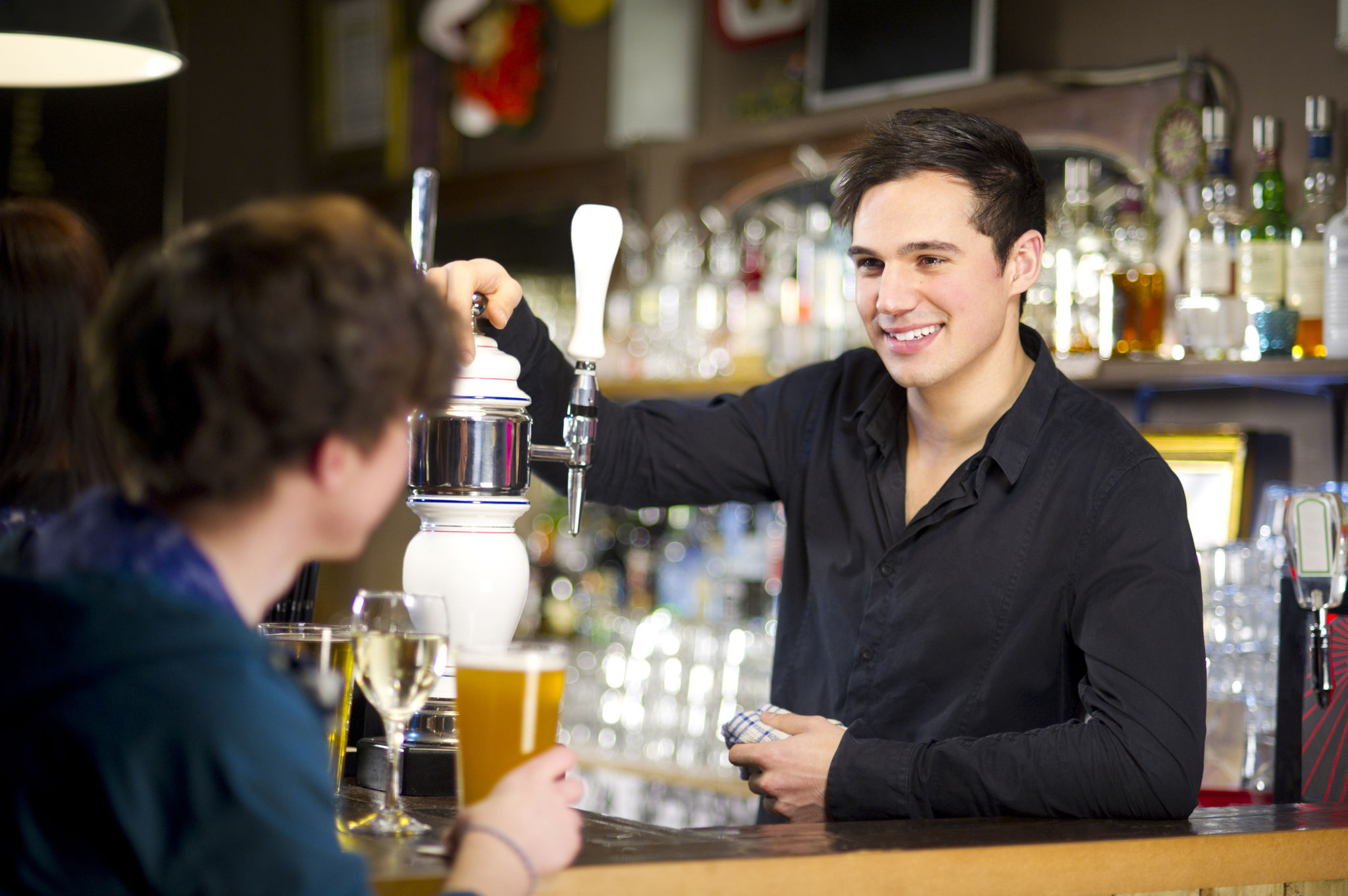 bartender with patrons