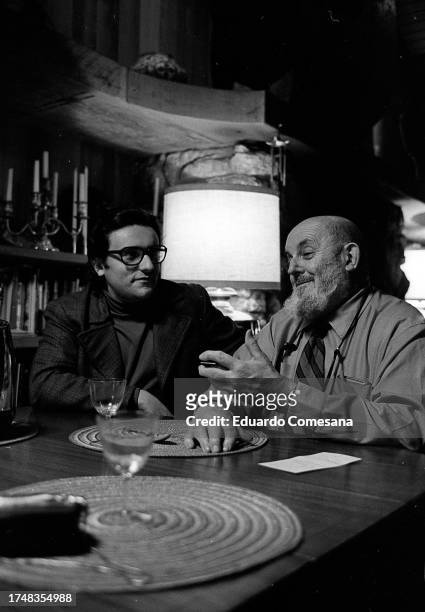View of Argentine photographer Eduardo Comesaña and American photographer Ansel Adams as they talk in the latter's home, Carmel, California, 1970.