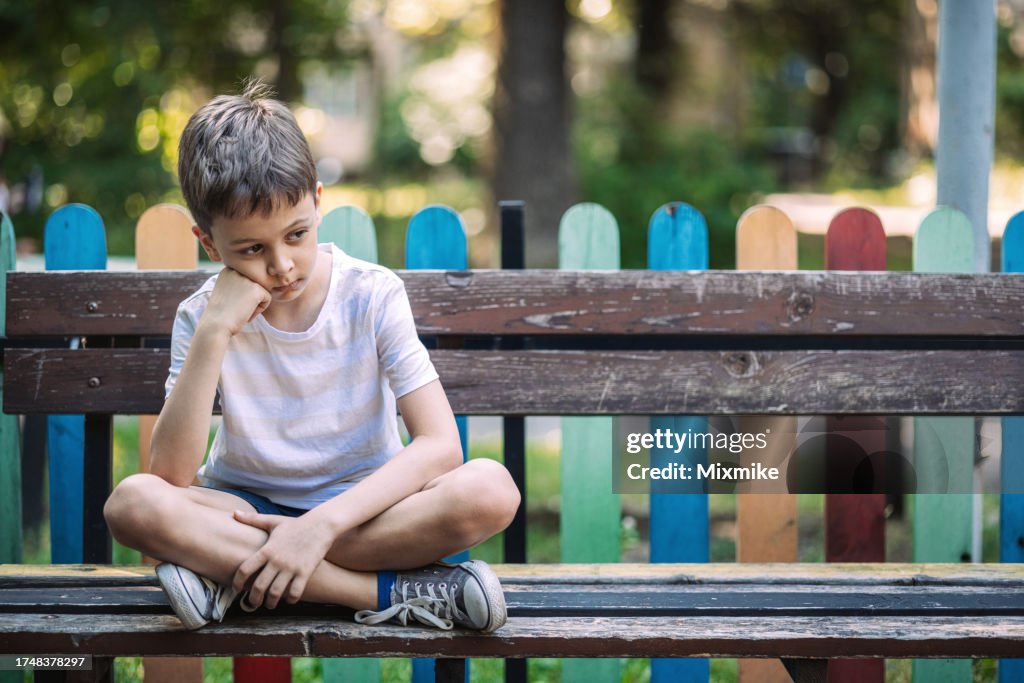 Lonely eight years old boy
