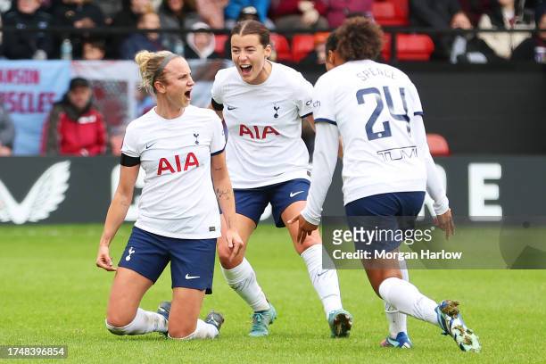 Martha Thomas of Tottenham Hotspur celebrates with teammate after scoring the team's third goal during the Barclays Women´s Super League match...