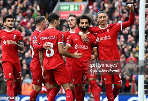 Mohamed Salah of Liverpool celebrates after scoring the opening goal during the Premier League match between Liverpool FC and Everton FC at Anfield...