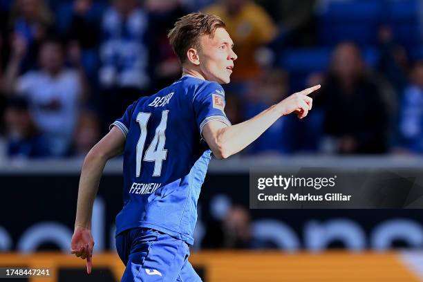 Maximilian Beier of TSG 1899 Hoffenheim celebrates after scoring the team's first goal during the Bundesliga match between TSG Hoffenheim and...