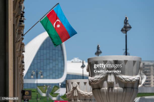 azerbaijan national flag, heydar aliyev conference centre, baku - azerbaijan stock pictures, royalty-free photos & images