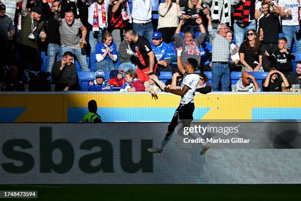 Ansgar Knauff of Eintracht Frankfurt celebrates after scoring the team's second goal during the Bundesliga match between TSG Hoffenheim and Eintracht...