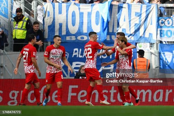 Ritsu Doan of Sport-Club Freiburg celebrates with teammates after scoring the team's first goal during the Bundesliga match between Sport-Club...