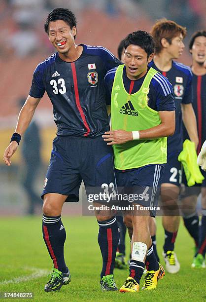 Yohei Toyoda and Ryota Moriwaki celebrate after the EAFF East Asian Cup match between Korea Republic and Japan at Jamsil Stadium on July 28, 2013 in...