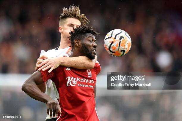 Reece Burke of Luton Town and Ibrahim Sangare of Nottingham Forest battle for a header during the Premier League match between Nottingham Forest and...