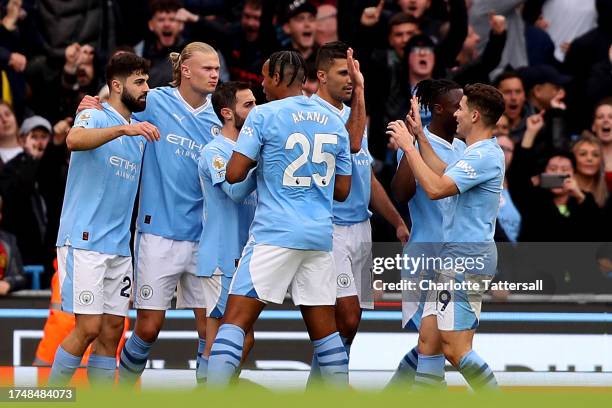 Erling Haaland of Manchester City celebrates after scoring the team's second goal with teammates during the Premier League match between Manchester...