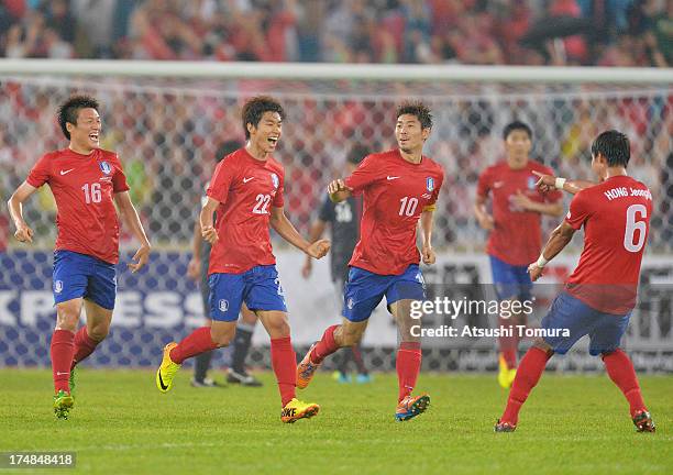 Yun Ill-ok of South Korea celebrates scoring his team's first goal with his team mates Lee Myung-joo , Ha Dae-sung and Hong Jeong-ho during the EAFF...