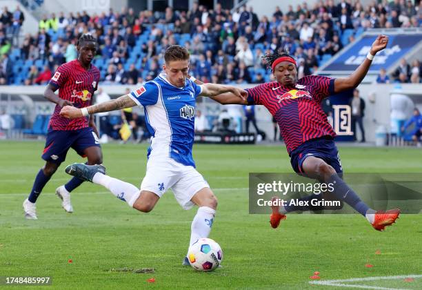 Marvin Mehlem of SV Darmstadt 98 shoots whilst under pressure from Mohamed Simakan of RB Leipzig during the Bundesliga match between SV Darmstadt 98...