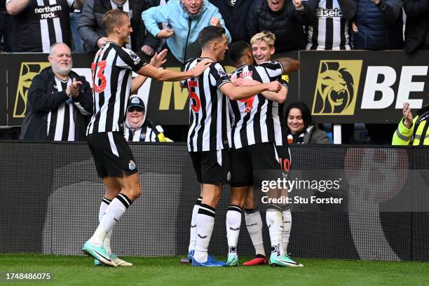 Anthony Gordon of Newcastle United celebrates after scoring the team's second goal with teammates during the Premier League match between Newcastle...