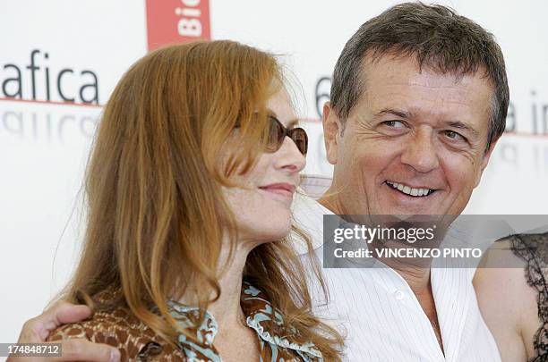 French film director Patrice Chereau and his compatriot and actress Isabelle Huppert pose during a photocall of Gabrielle, 05 september 2005, during...