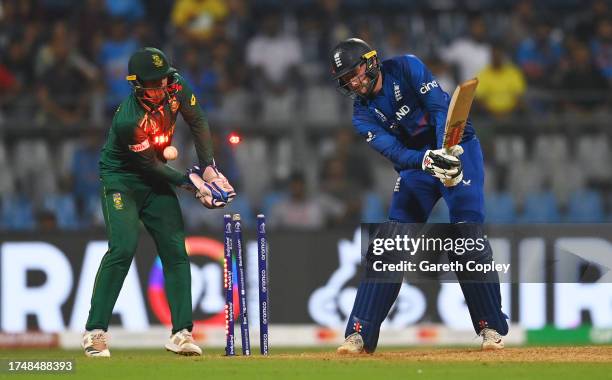 Gus Atkinson of England is bowled for 35 by Keshav Maharaj of South Africa during the ICC Men's Cricket World Cup India 2023 match between England...