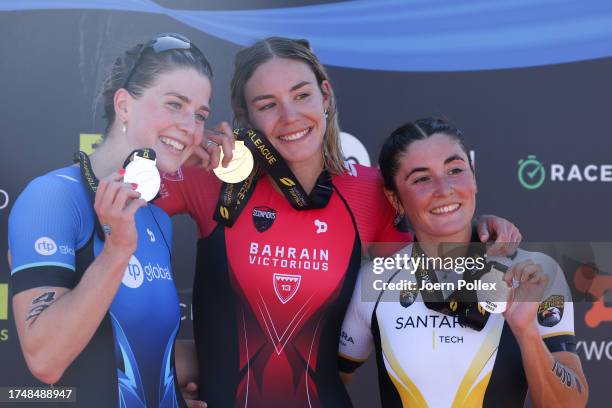 Second placed Kate Waugh of Great Britain, first placed Cassandre Beaugrand of France and third place Jeanne Lehair of Luxembourg pose for a photo...