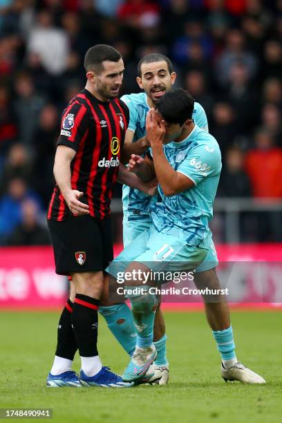 Lewis Cook of AFC Bournemouth clashes with Hwang Hee-Chan of Wolverhampton Wanderers, which later results in a red card for Lewis Cook, during the...