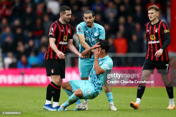 Lewis Cook of AFC Bournemouth clashes with Hwang Hee-Chan of Wolverhampton Wanderers, which later results in a red card for Lewis Cook, during the...