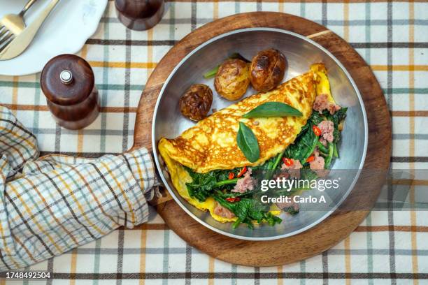 omelette with sausage and broccoli rabe - spinach frittata stock pictures, royalty-free photos & images