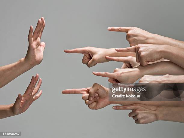 group of hands with pointing finger - clashes stock pictures, royalty-free photos & images