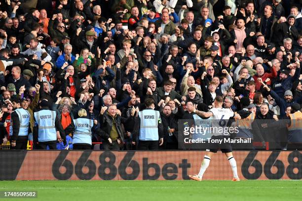Ross Barkley of Luton Town celebrates as Elijah Adebayo of Luton Town scores the team's second goal to equalise during the Premier League match...