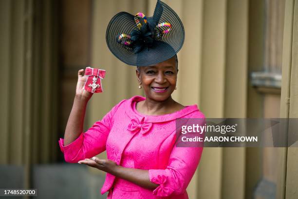 Kathleen Williams, Director of RJC Dance, poses with their medal after being appointed a Member of the Order of the British Empire following an...