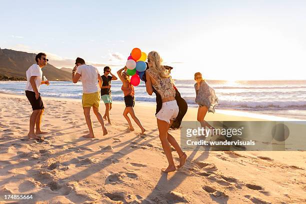 young party people having fun at the beach - beach music festival stock pictures, royalty-free photos & images