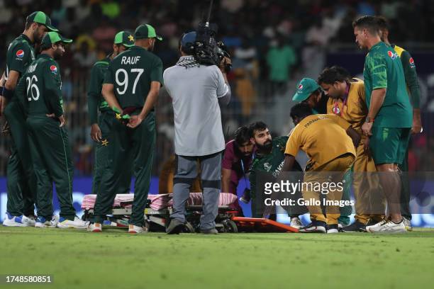 Pakistan's Shadab Khan receives medical attention during the ICC Men's Cricket World Cup 2023 match between South Africa and Pakistan at MA...
