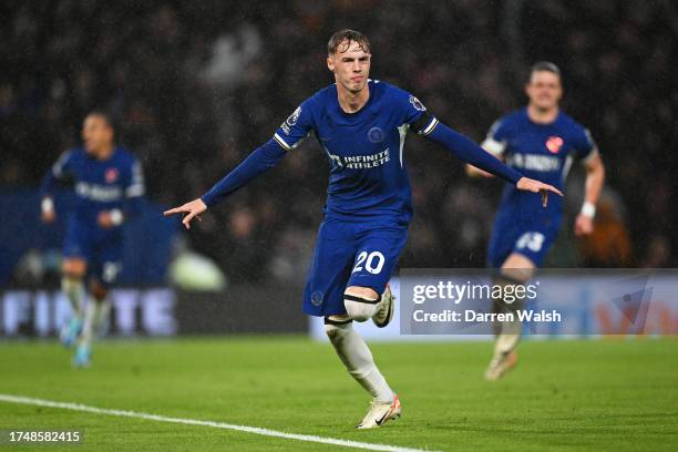 Cole Palmer of Chelsea celebrates after scoring the team's first goal during the Premier League match between Chelsea FC and Arsenal FC at Stamford...