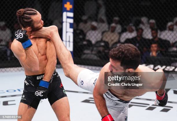Javid Basharat of Afghanistan kicks Victor Henry in a bantamweight fight during the UFC 294 event at Etihad Arena on October 21, 2023 in Abu Dhabi,...