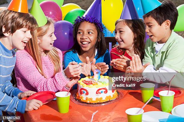 en fiesta de cumpleaños para niños - girl sitting on boys face fotografías e imágenes de stock