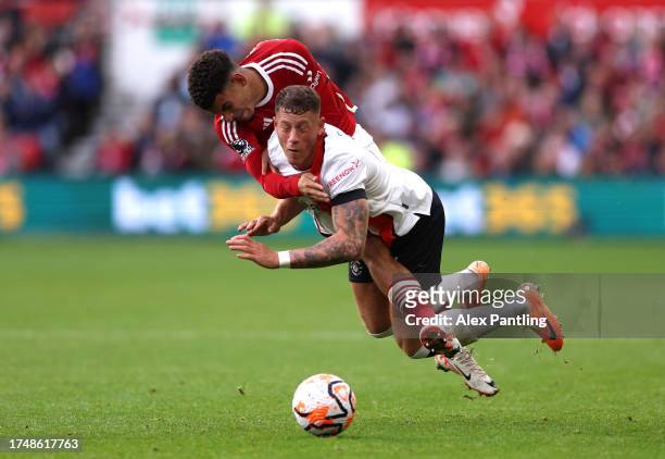 Ross Barkley of Luton Town is tackled by Morgan Gibbs-White of Nottingham Forest during the Premier League match between Nottingham Forest and Luton...