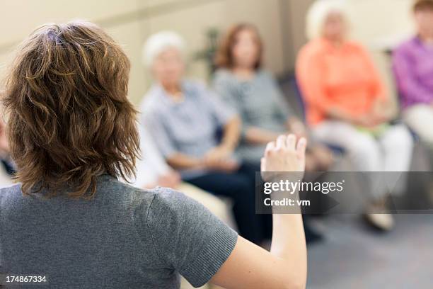 social worker in the community center - face covered stock pictures, royalty-free photos & images