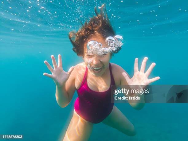 portrait of a crazy teenage girl shouting underwater - drowning girl stock pictures, royalty-free photos & images