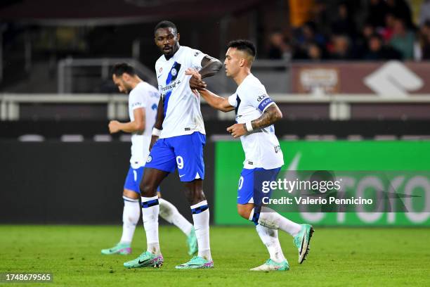 Lautaro Martinez of FC Internazionale celebrates with teammate Marcus Thuram after scoring the team's second goal during the Serie A TIM match...
