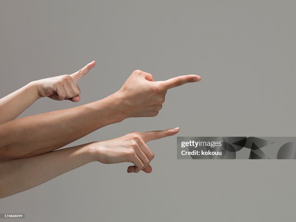 Three arms pointing at the same direction.