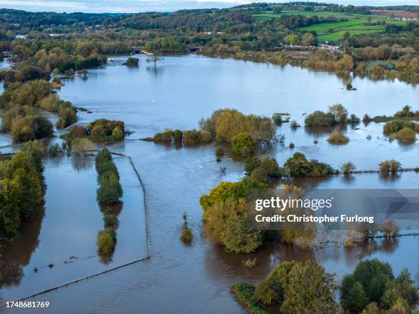 An aerial view of flooded fields near Derby rugby Club after the River Derwent burst its banks during storm Babet on October 21, 2023 in Derby,...