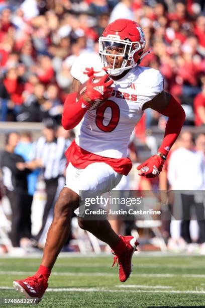 Eric Rogers of the Rutgers Scarlet Knights returns a blocked punt for a touchdown during the first half in the game against the Indiana Hoosiers at...