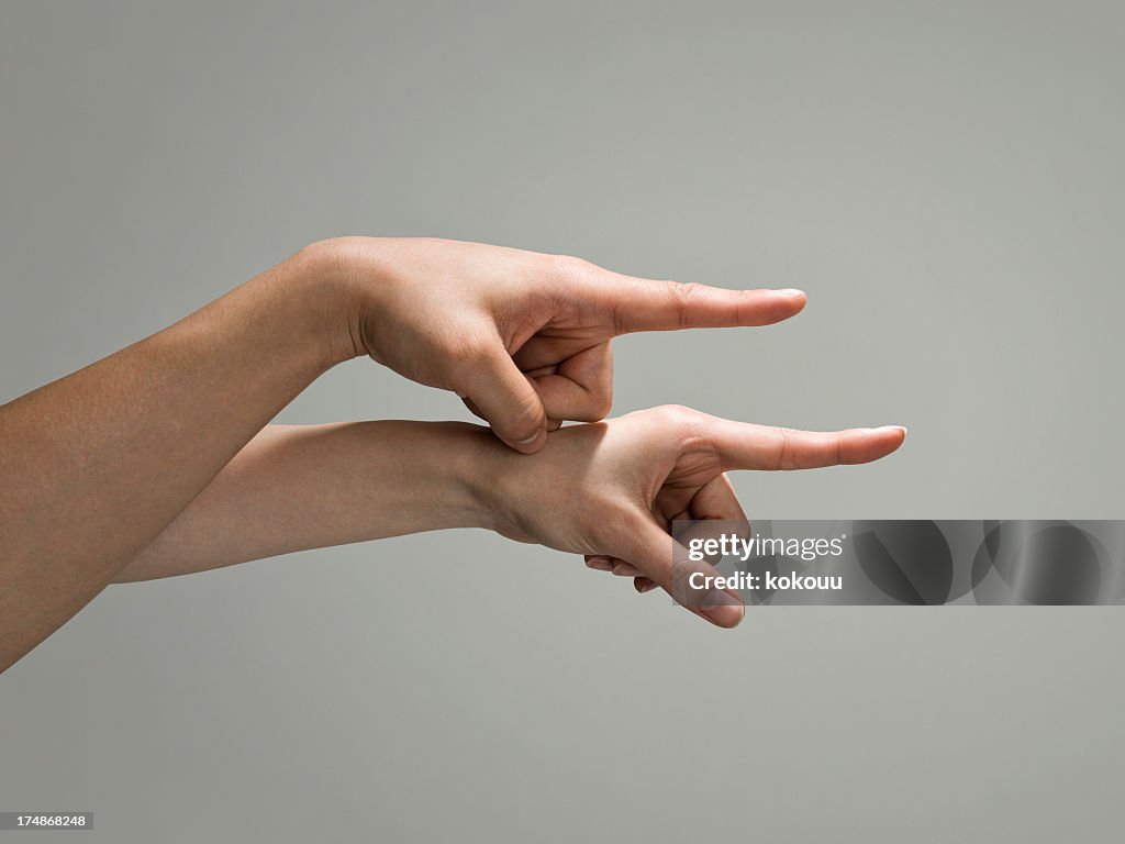 Two hand pointing in the same direction.