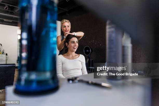 happy female customer with hairstylist at salon - beautician stock pictures, royalty-free photos & images