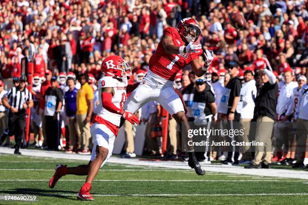 Donaven McCulley of the Indiana Hoosiers attempts to catch a pass while defended by Eric Rogers of the Rutgers Scarlet Knights during the first half...