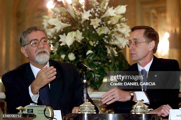 Brazilian Foreign Minister Celso Lafer sits next to his Argentinian counterpart Adalberto Rodriguez Giavariani, in the conference room of the San...