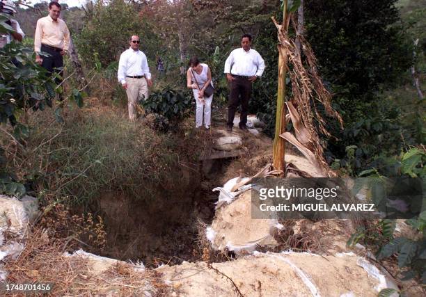 Nicaraguan Vice-Chancellor Bertha Arguello looks at old army trenches 27 April 2001 in Las Manos, Nicaragua, at the border with Honduras. La vice...