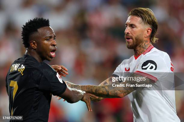 Vinicius Junior of Real Madrid and Sergio Ramos of Sevilla FC clash during the LaLiga EA Sports match between Sevilla FC and Real Madrid CF at...