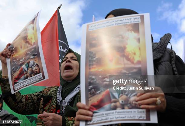 Pro-Palestinian protesters carry signs during a demonstration calling for a ceasefire in Gaza on October 21, 2023 in Washington, DC. Thousands of...