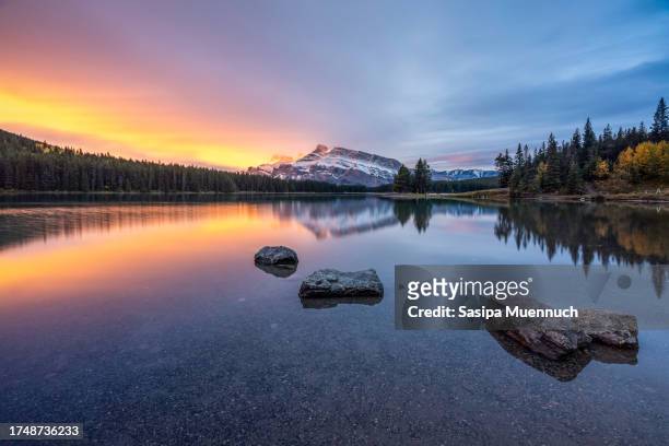 two jack lake at sunrise, banff national park, alberta, canada - international landmark stock pictures, royalty-free photos & images