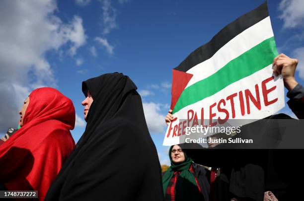 Pro-Palestinian protester holds a sign during a demonstration calling for a ceasefire in Gaza on October 21, 2023 in Washington, DC. Thousands of...