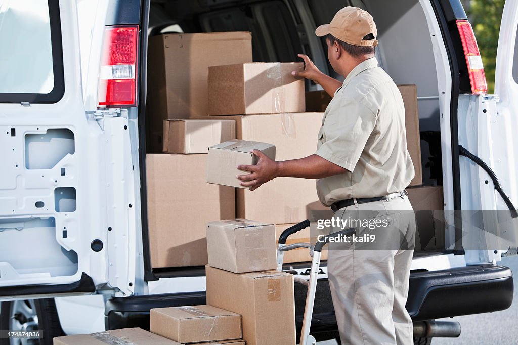 Hispanic man delivering packages