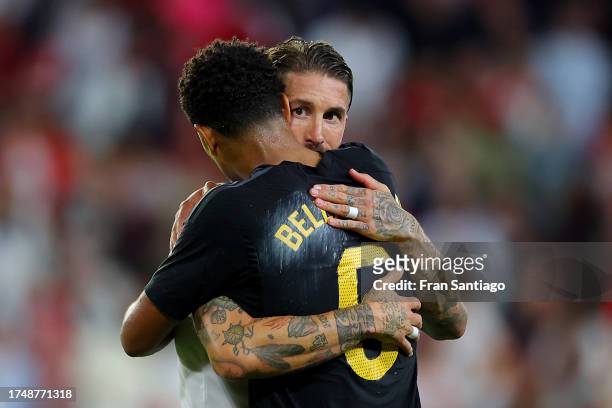 Jude Bellingham of Real Madrid and Sergio Ramos of Sevilla FC interact afterg the LaLiga EA Sports match between Sevilla FC and Real Madrid CF at...