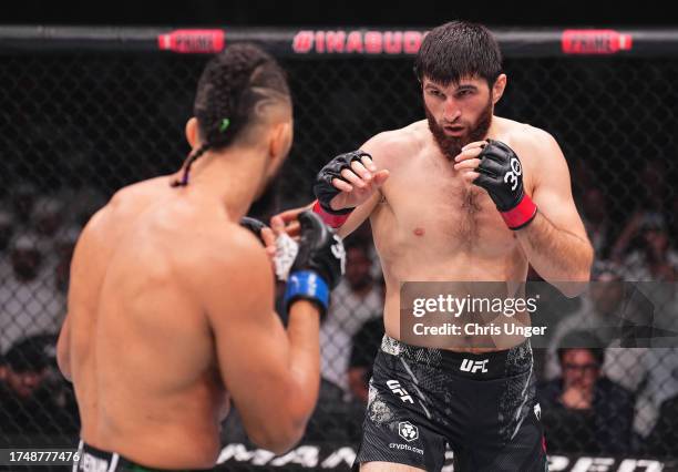 Magomed Ankalaev of Russia battles Johnny Walker of Brazil in a light heavyweight fight during the UFC 294 event at Etihad Arena on October 21, 2023...