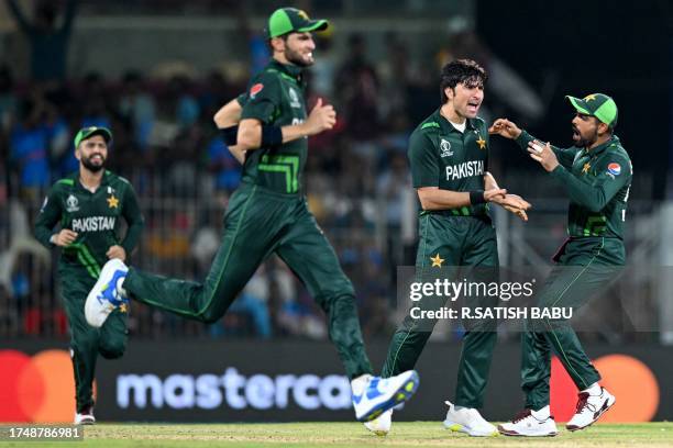Pakistan's Mohammad Wasim celebrates with teammates after taking the wicket of South Africa's Heinrich Klaasen during the 2023 ICC Men's Cricket...